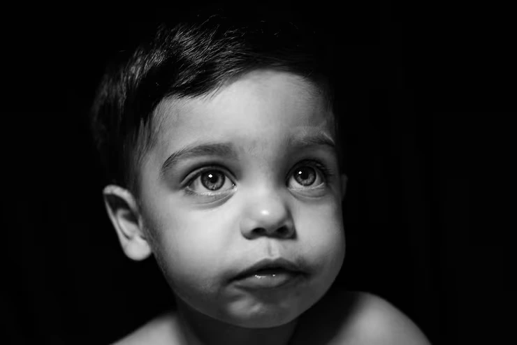 baby boy black background with light reflecting his face 58702 1403